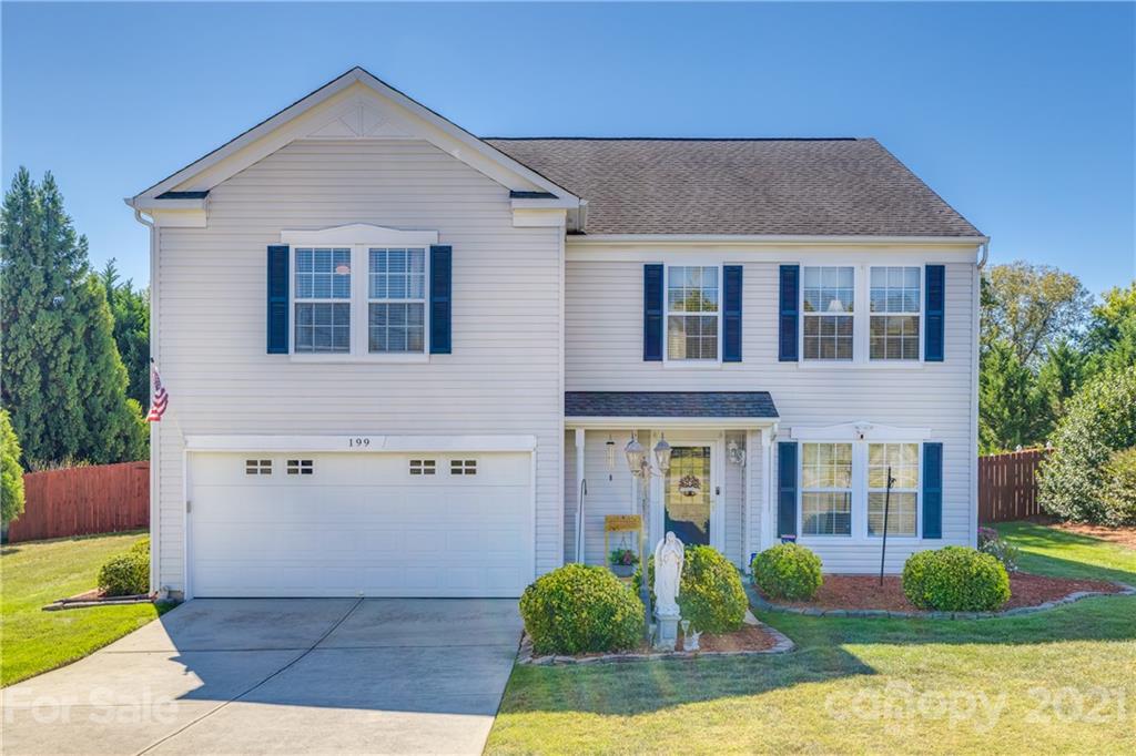 199 Old Carriage Road Clover, SC 29710 - Photo 1 of 48 a front view of a house with garden