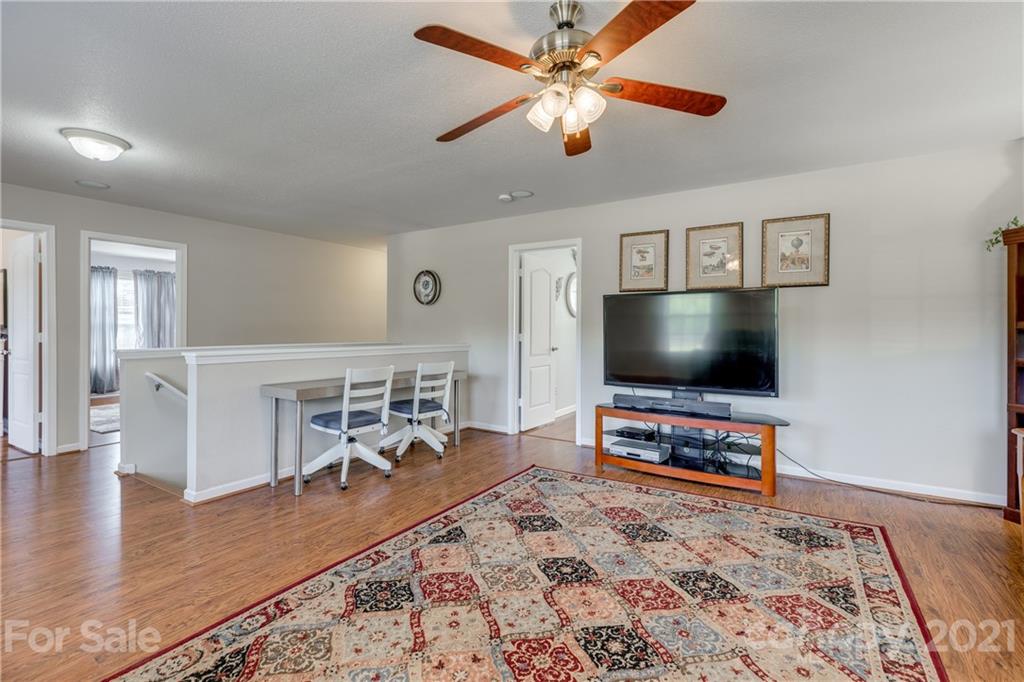 199 Old Carriage Road Clover, SC 29710 - Photo 29 of 48 a living room with furniture and a flat screen tv