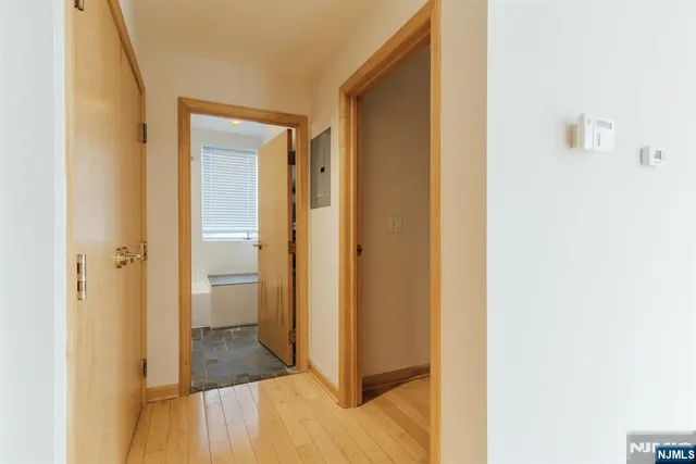 a view of a bathroom with a sink and a mirror
