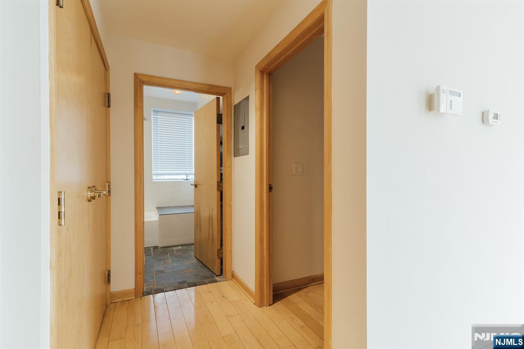 30 Park Avenue, Unit 2 Rutherford, NJ 07070 - Photo 22 of 31 a view of a bathroom with a sink and a mirror