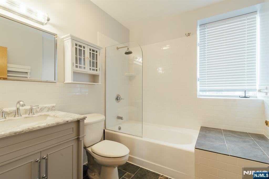 30 Park Avenue, Unit 2 Rutherford, NJ 07070 - Photo 23 of 31 a bathroom with a sink toilet and shower