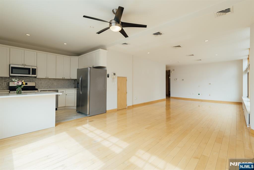 30 Park Avenue, Unit 2 Rutherford, NJ 07070 - Photo 10 of 31 a view of a kitchen with a sink and a refrigerator