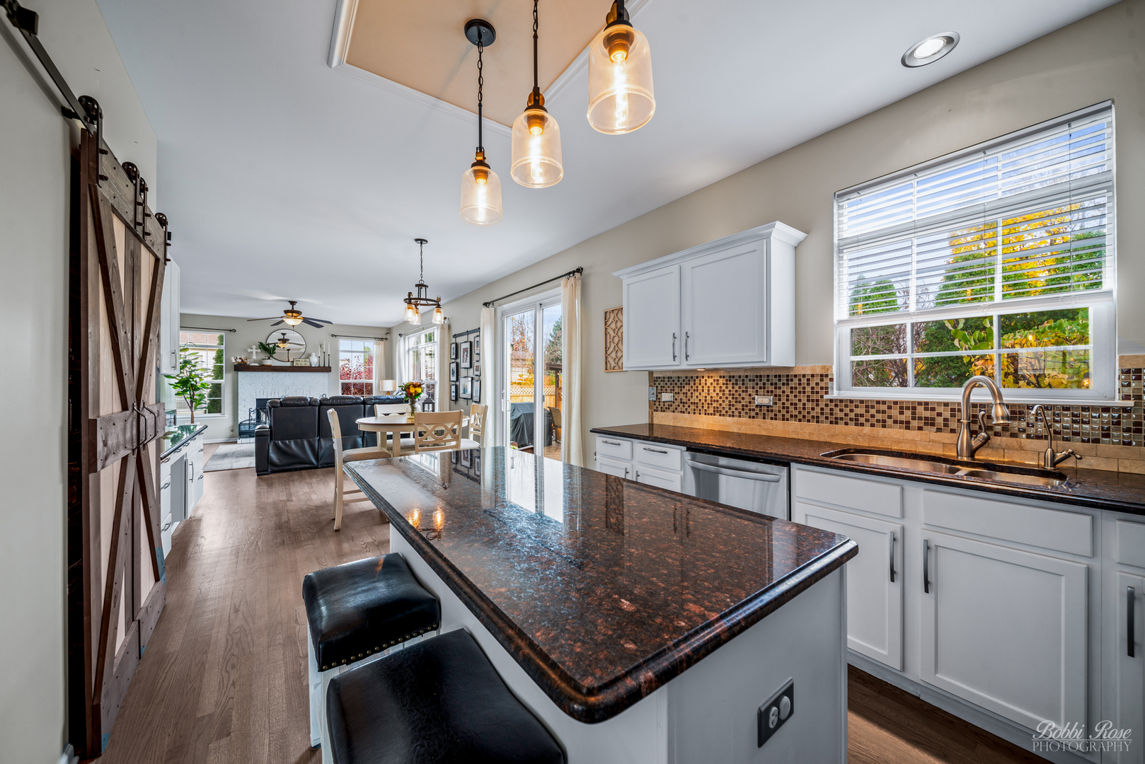 892 Audubon Lane Aurora, IL 60506 - Photo 12 of 53 a kitchen with stainless steel appliances granite countertop a sink a stove and a microwave