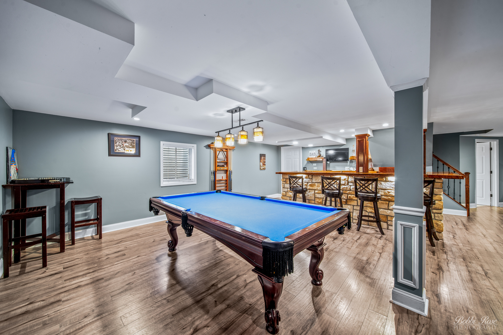 892 Audubon Lane Aurora, IL 60506 - Photo 38 of 53 a room with furniture pool table wooden floor and windows