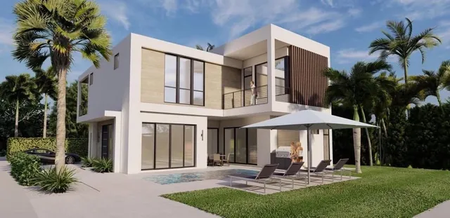 a front view of a house with yard patio and fire pit