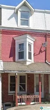 a front view of a building with many windows
