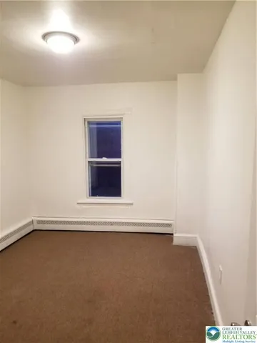 a view of a kitchen with a sink dishwasher and a microwave oven