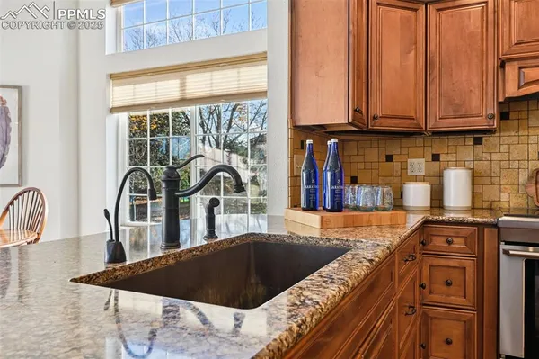 a kitchen with a stove a sink and a microwave