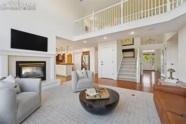 a spacious bedroom with a bed and a fireplace