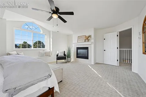 a bed room with a bed and a fireplace