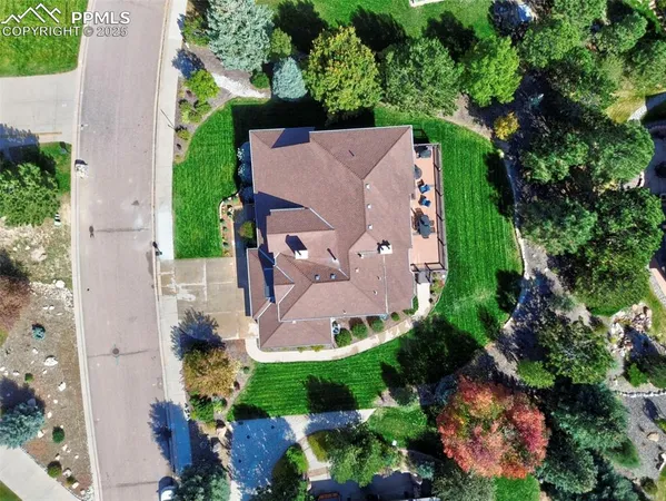 an aerial view of a house with a garden