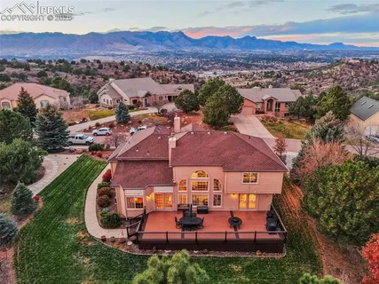 an aerial view of a house with pool
