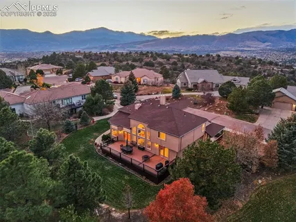 an aerial view of a house with mountain view