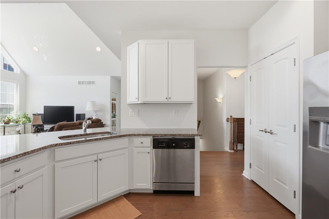 4120 Eveningstar Road Emmaus, PA 18049 - Photo 13 of 62 Granite counters and stainless appliances define this open-concept kitchen.
