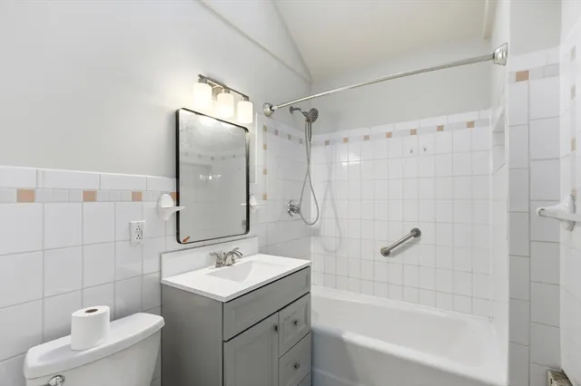 a bathroom with a sink toilet tub and shower