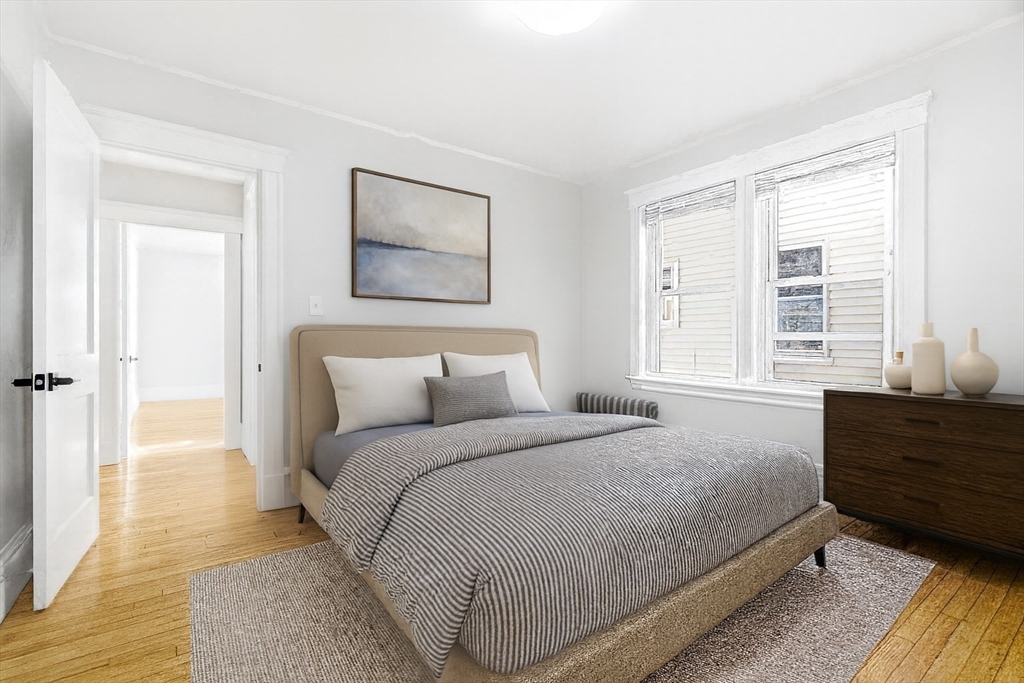 29-31 Edward T Sullivan Road, Unit 2 Cambridge, MA 02138 - Photo 19 of 34 a bedroom with a bed and a window