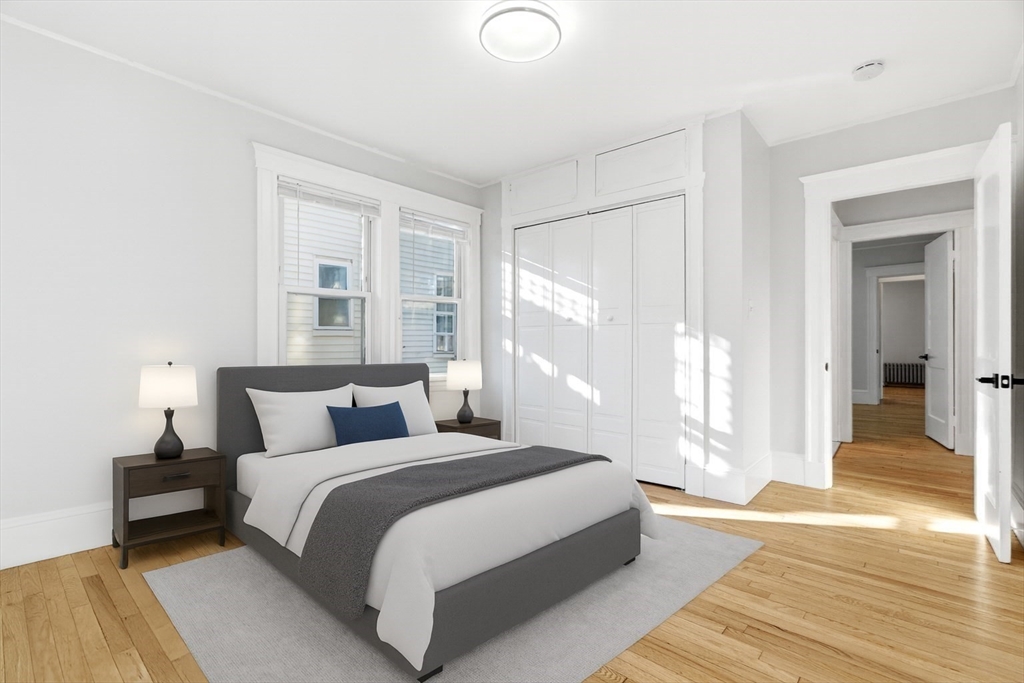 29-31 Edward T Sullivan Road, Unit 2 Cambridge, MA 02138 - Photo 3 of 34 a bedroom with a bed and a large window