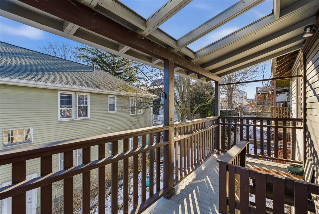 29-31 Edward T Sullivan Road, Unit 2 Cambridge, MA 02138 - Photo 31 of 34 a view of a two chairs in the balcony