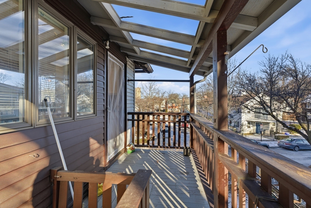 29-31 Edward T Sullivan Road, Unit 2 Cambridge, MA 02138 - Photo 32 of 34 a view of balcony with wooden floor