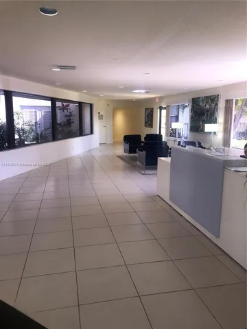 a view of kitchen with furniture and window