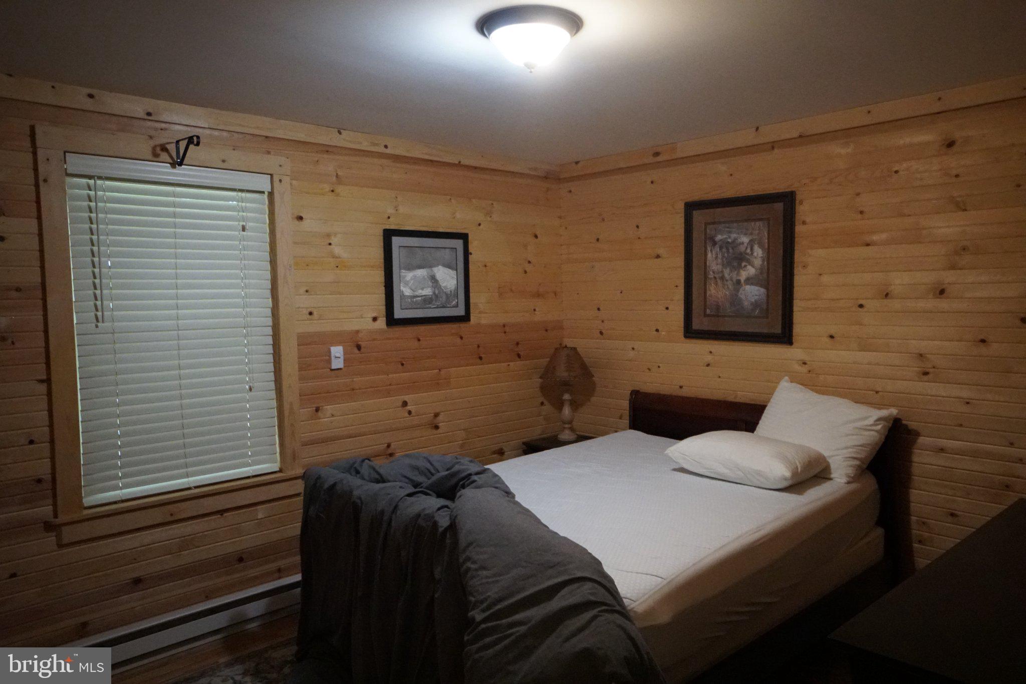 150 Sharp Ridge Lane Franklin, WV 26807 - Photo 25 of 69 Cozy wooden retreat for restful nights.
