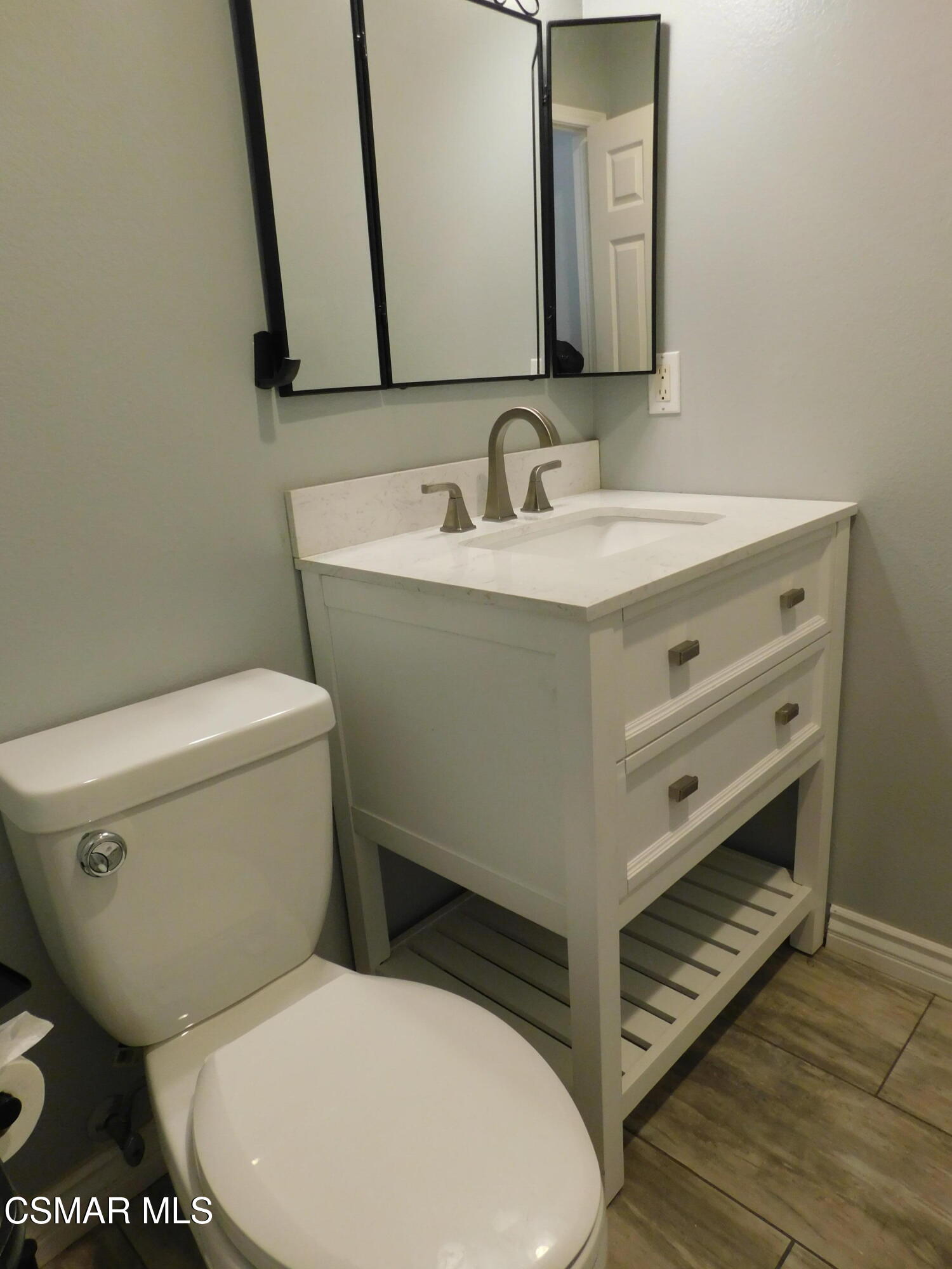 728 Navito Way Oxnard, CA 93030 - Photo 36 of 43 a bathroom with a toilet sink and mirror