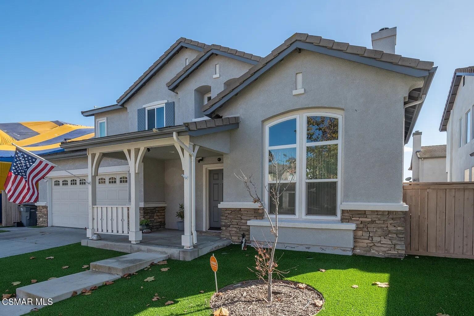 728 Navito Way Oxnard, CA 93030 - Photo 4 of 43 a front view of a house with a yard