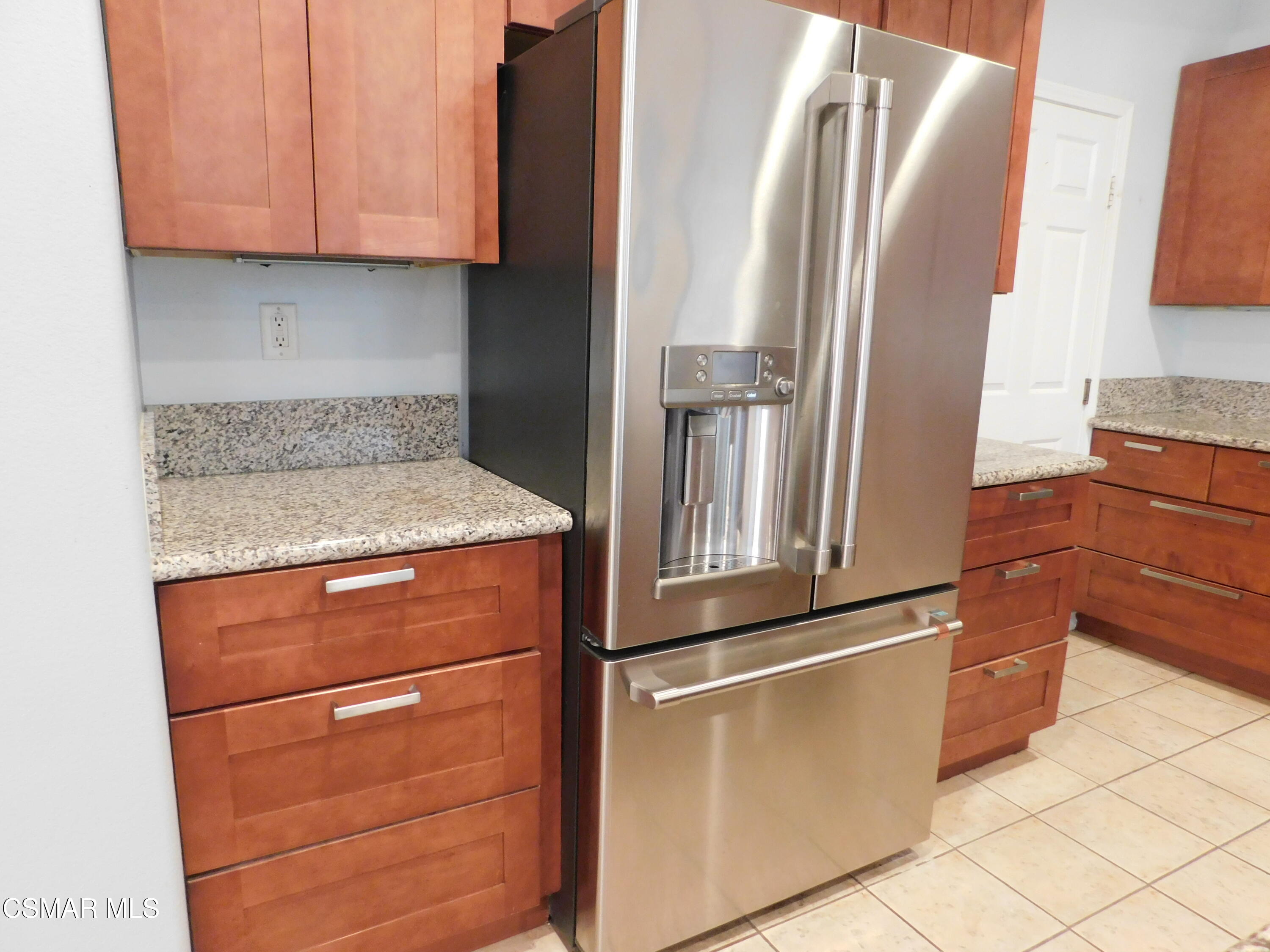 728 Navito Way Oxnard, CA 93030 - Photo 10 of 43 a kitchen with stainless steel appliances granite countertop a refrigerator and a stove