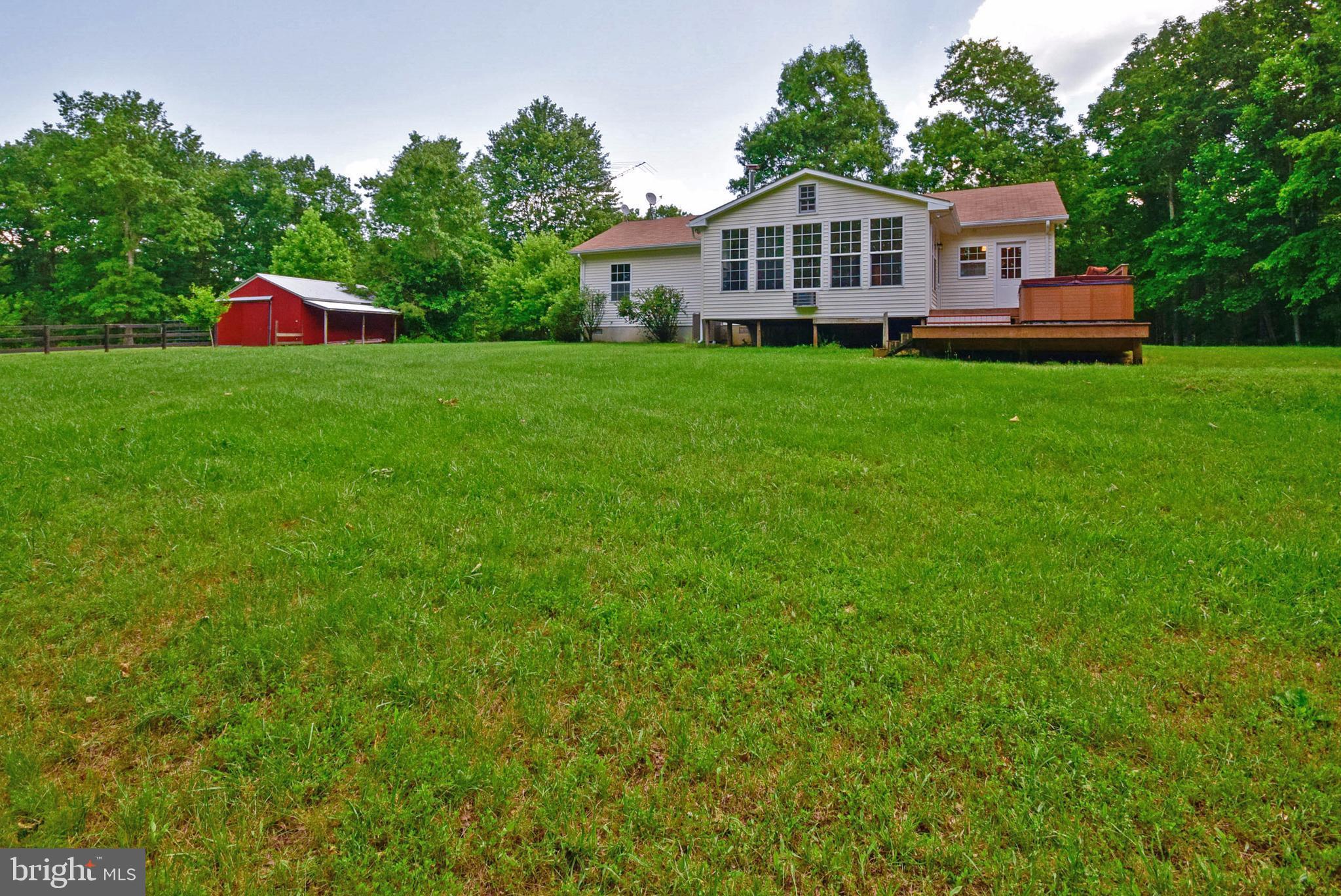 12524 Tower Hill Road Midland, VA 22728 - Photo 6 of 30 View of back of home and sun room.