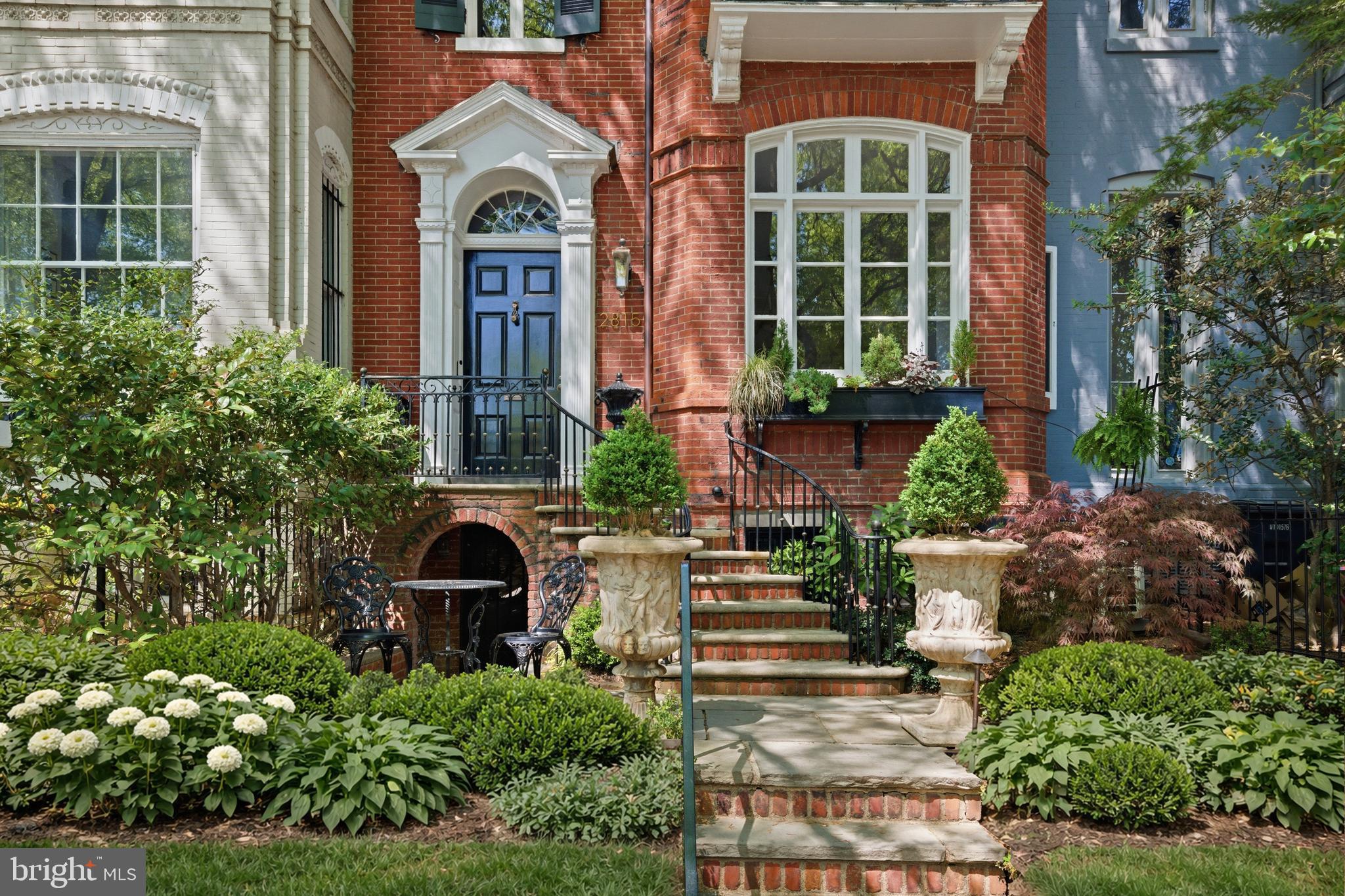 2815 Q Street Northwest Washington, DC 20007 - Photo 1 of 32 a front view of a house with a garden