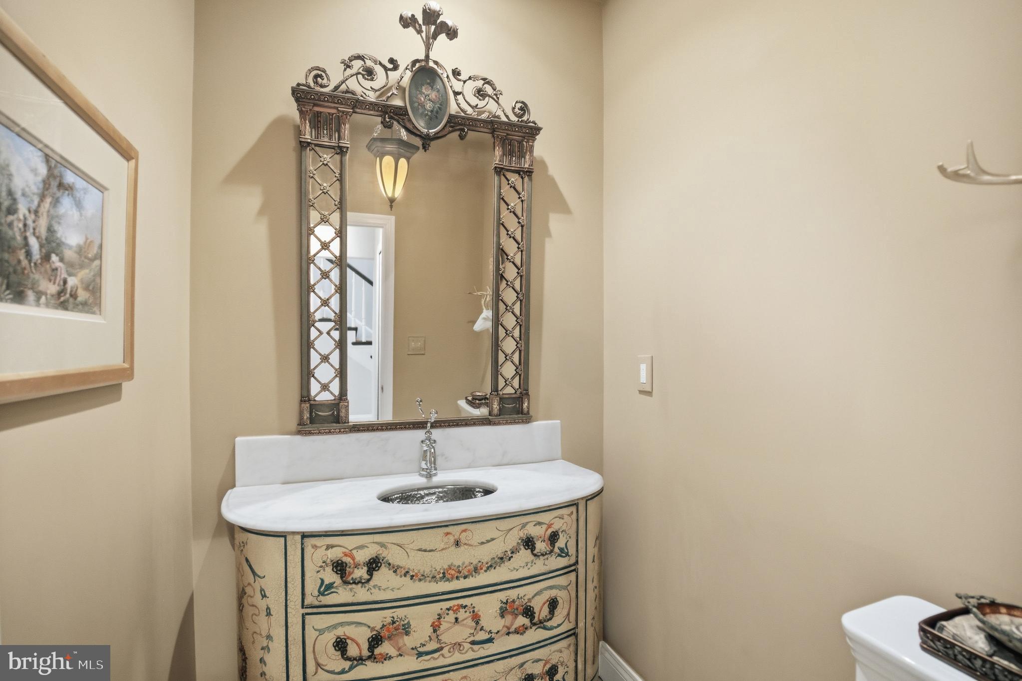 2815 Q Street Northwest Washington, DC 20007 - Photo 13 of 32 a bathroom with a sink and a mirror
