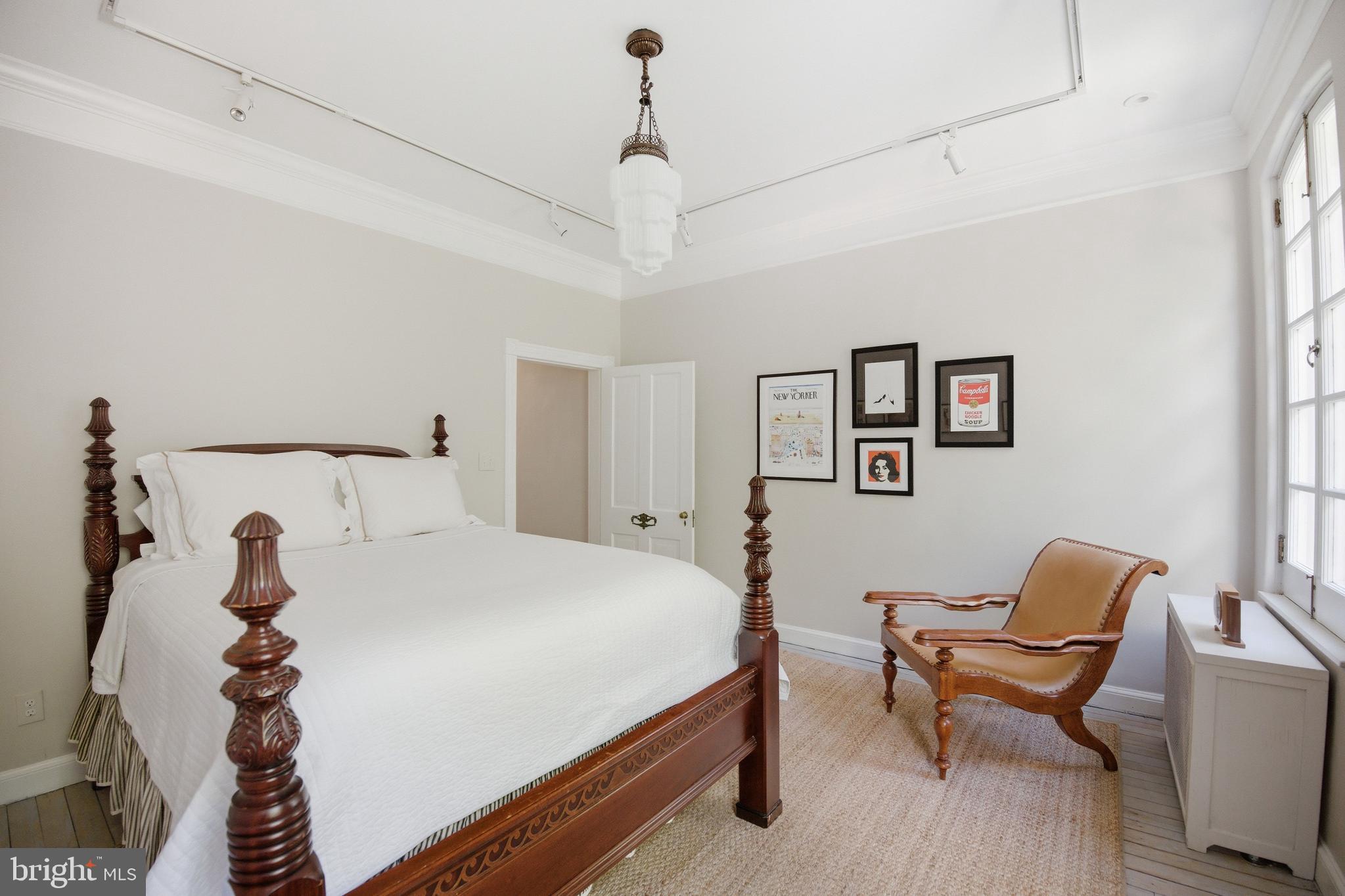 2815 Q Street Northwest Washington, DC 20007 - Photo 21 of 32 a bedroom with a bed and a chair