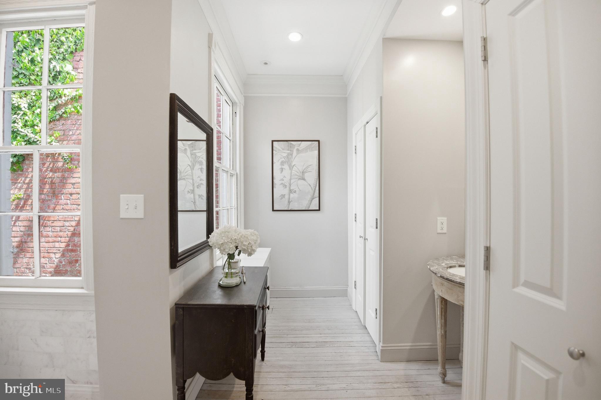 2815 Q Street Northwest Washington, DC 20007 - Photo 23 of 32 a view of bathroom with a toilet a sink and a mirror