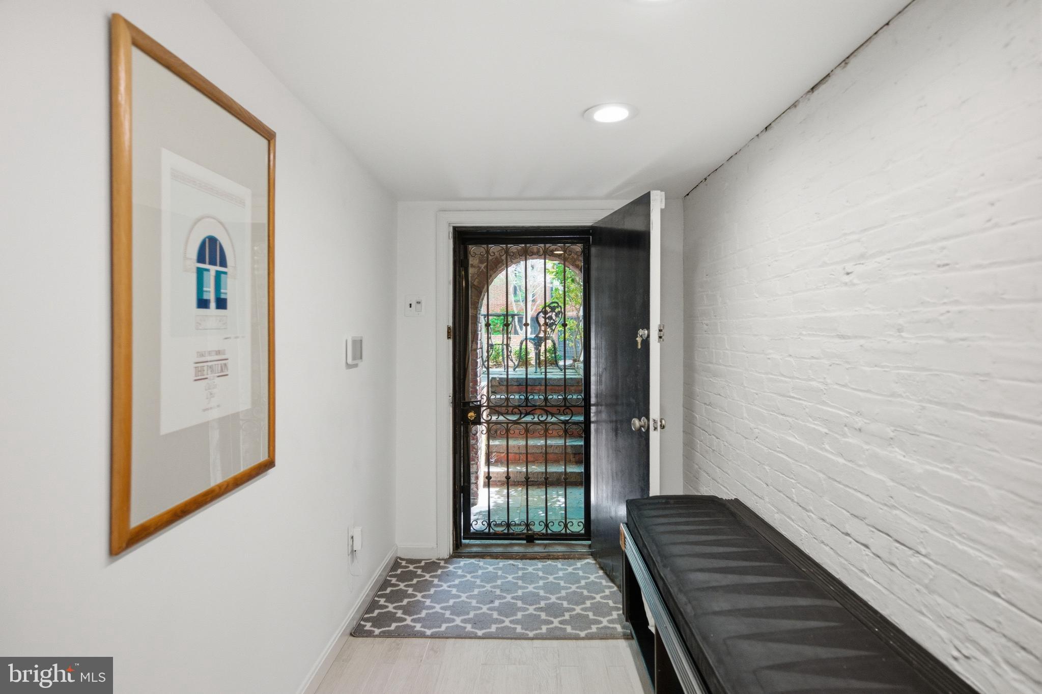 2815 Q Street Northwest Washington, DC 20007 - Photo 26 of 32 a view of a hallway view with wooden floor and staircase