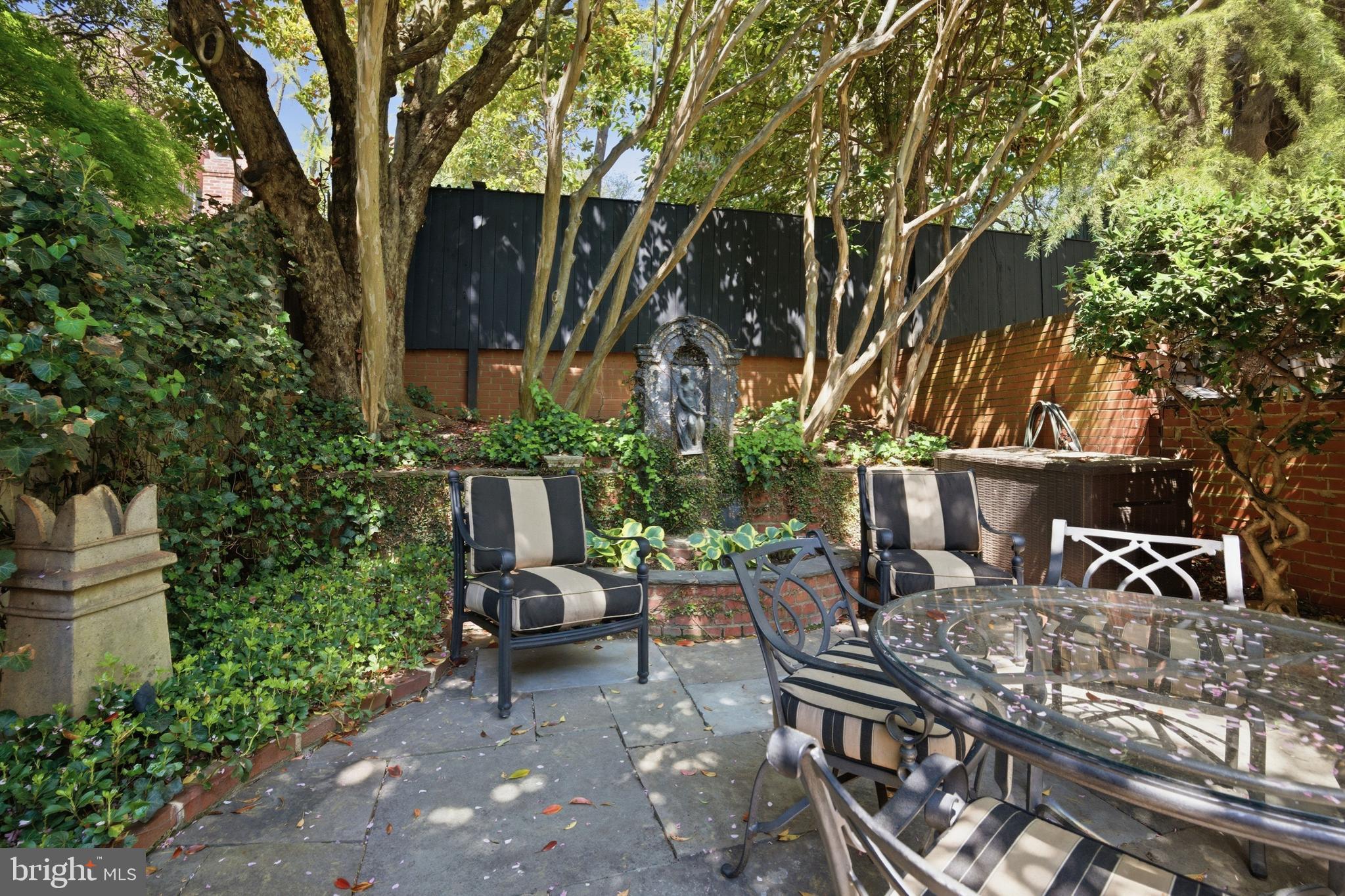 2815 Q Street Northwest Washington, DC 20007 - Photo 30 of 32 a view of a patio with table and chairs and potted plants