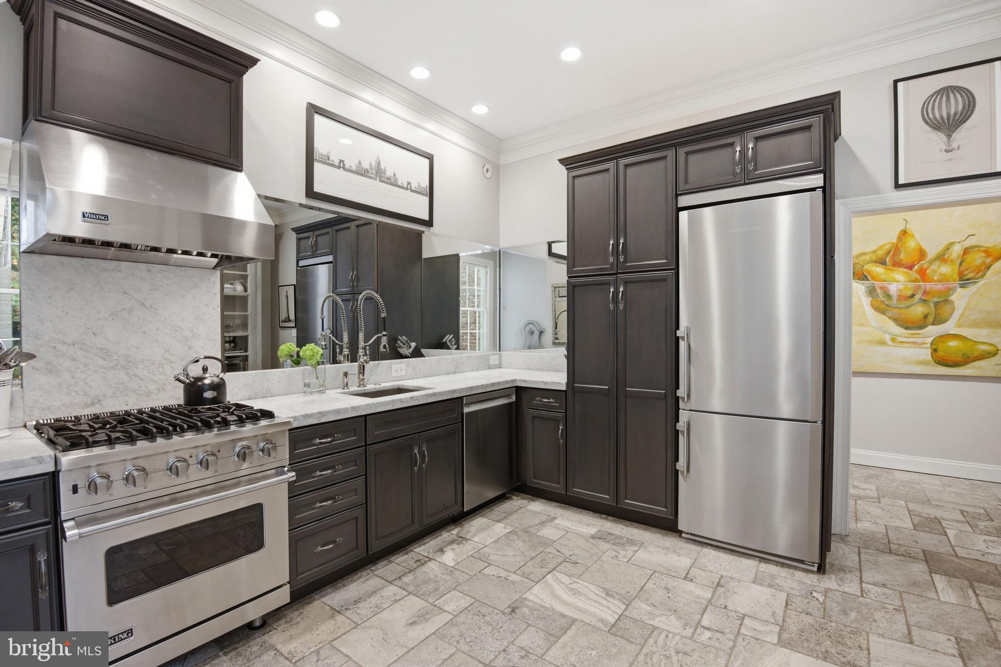 2815 Q Street Northwest Washington, DC 20007 - Photo 8 of 32 a kitchen with stainless steel appliances granite countertop a refrigerator sink and stove
