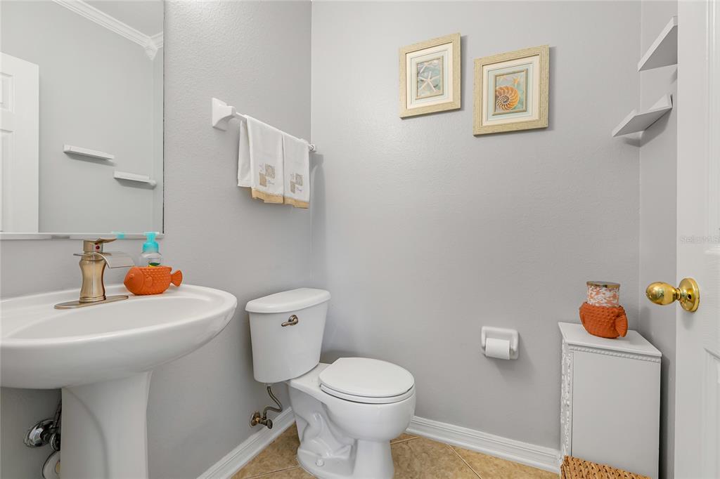 14847 Skip Jack Loop Lakewood Ranch, FL 34202 - Photo 12 of 26 a bathroom with a sink toilet and mirror