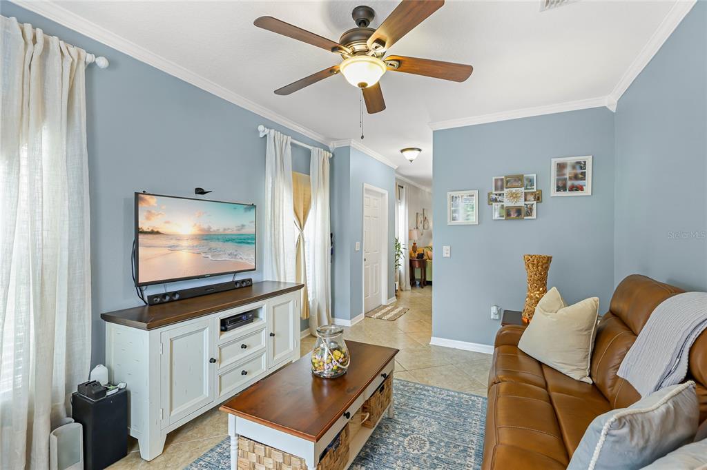 14847 Skip Jack Loop Lakewood Ranch, FL 34202 - Photo 14 of 26 a living room with furniture and a flat screen tv