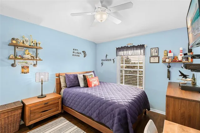 a bedroom with bed and window