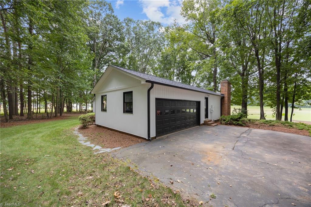 2830 Barnett Road Mebane, NC 27302 - Photo 4 of 48 Side entry garage and ample driveway parking.