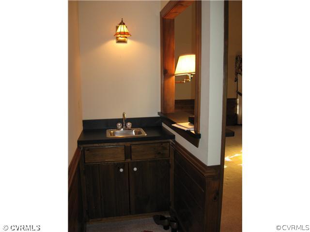 5224 Copperpenny Road Chesterfield, VA 23832 - Photo 3 of 12 a bathroom with a sink and mirror