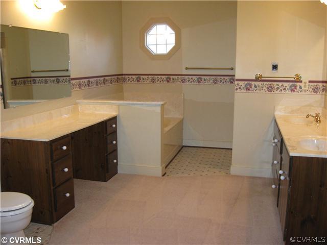 5224 Copperpenny Road Chesterfield, VA 23832 - Photo 10 of 12 a bathroom with a sink vanity and toilet