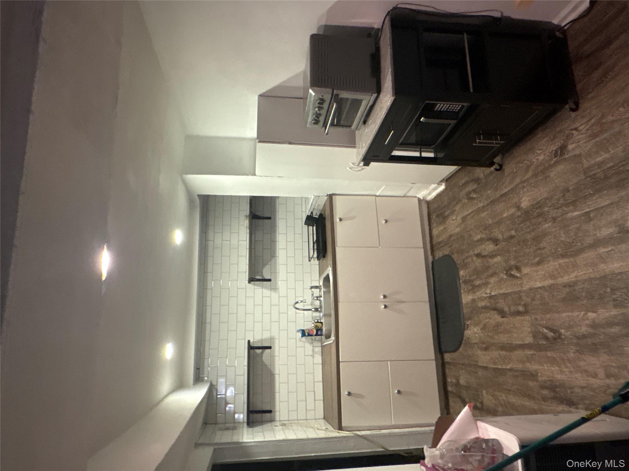 a kitchen with granite countertop a stove and a refrigerator