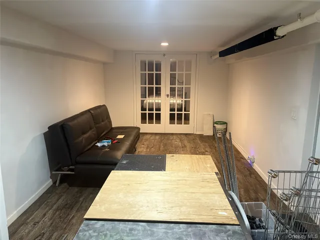 a living room with furniture rug and wooden floor