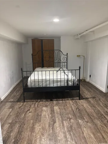 a bathroom with a sink a toilet a mirror and shower