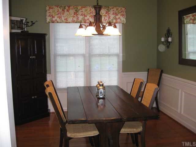 5416 Staysail Court Raleigh, NC 27613 - Photo 3 of 12 a view of a dining room with furniture window and wooden floor