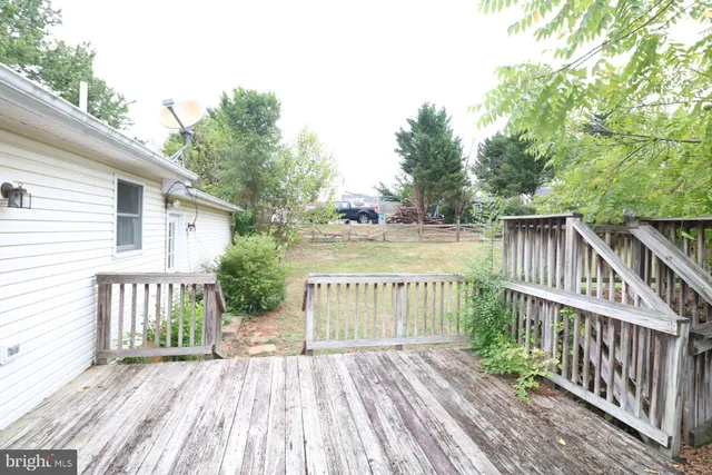 a view of a wooden deck with a patio