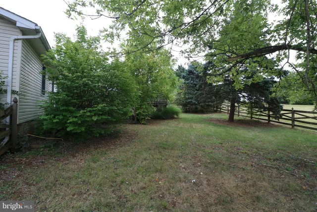 a view of outdoor space with deck and yard