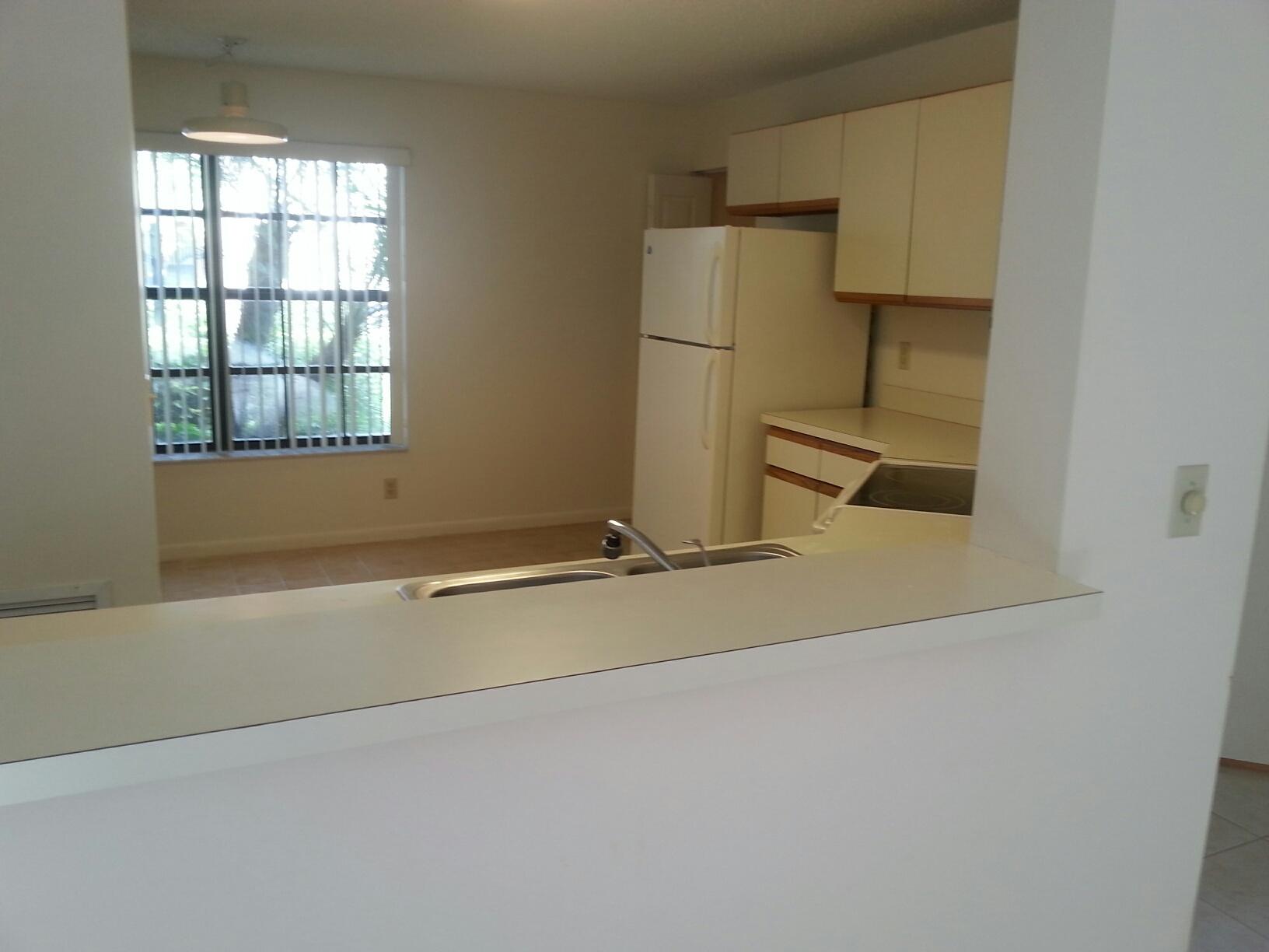 3249 Perimeter Drive Greenacres, FL 33467 - Photo 8 of 15 3249 Kitchen pass-thru