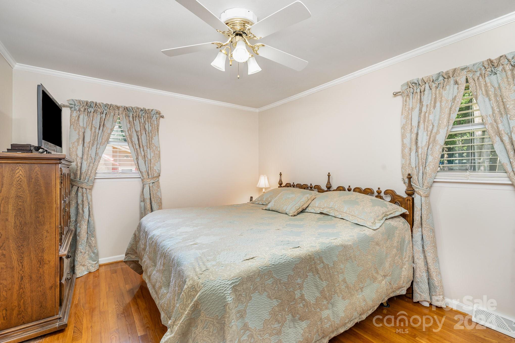 6308 Sunset Circle Charlotte, NC 28216 - Photo 14 of 30 a bedroom with a bed and a window